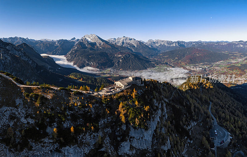 Aerial panorama of Berchtesgaden mountains and fog over of Konigssee lake at autumn morning, Germany.